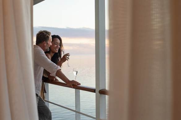 Paul Gauguin Cruises MS Paul Gauguin Couple on Balcony 1 ©Paul Gauguin Cruises.jpg
